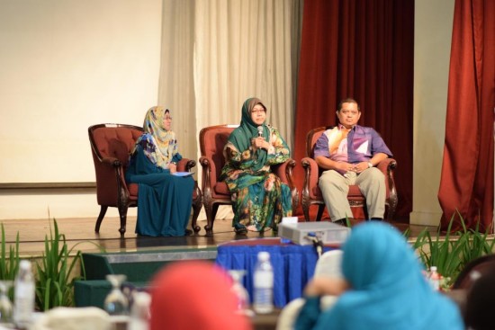Dr Faridah Idris (left) with the couple who shared their experience with induced lactation to breastfeed their adopted child.